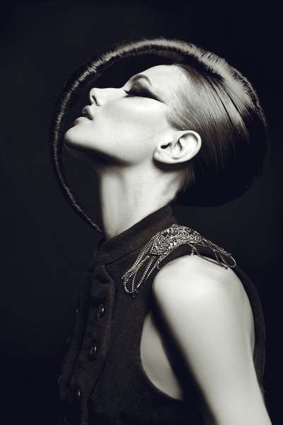 Hair extensions used on this short haired model for theatrical editorial result. 
